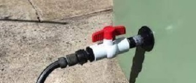 Watertight seal with attached ball valve on the side wall of a tank